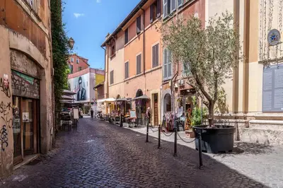 a cobblestone street in a city with buildings at Le Lune Apartment in Rome