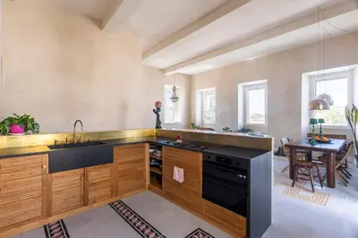 a large kitchen with a sink and a table at Labicasa in Rome