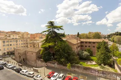 a city with cars parked in a parking lot at Labicasa in Rome