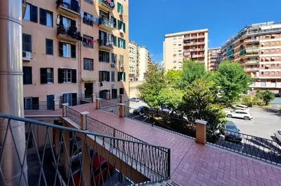 a view from a balcony of a city with buildings at Stazione Trastevere 3BR Flat by Flatinrome in Rome