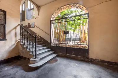 an entrance to a building with an iron gate at NOH Forum Studio in Rome