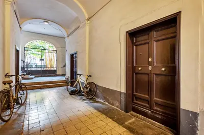 two bikes parked in a hallway next to a door at NOH Forum Studio in Rome