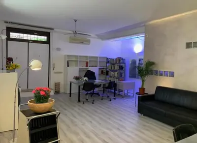 a living room with a couch and a table at Orchidea Bianca Home in Rome