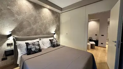 a bedroom with a bed with a wall mural at CEMMA luxury apartment in Rome