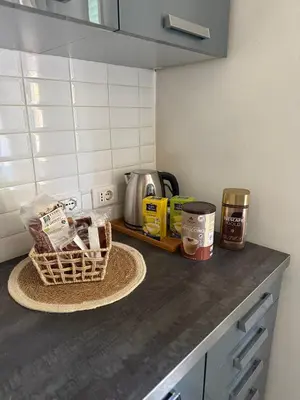 a kitchen counter with items on a counter top at Volupta' s house Trastevere Station in Rome