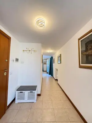 a hallway with a stairwell with a bench in it at Rooftop View St Peter by Dama in Rome