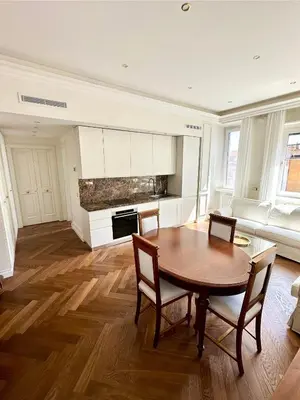 a large living room with a table and chairs at Dandy Elegance Loft in Rome