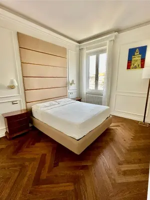 a bedroom with a large bed in a room at Dandy Elegance Loft in Rome