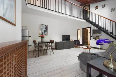 a living room with a couch and a table at Fidelio Holiday Home in Rome