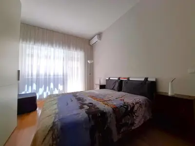 a bedroom with a large bed and a window at Sophìa, City Retreat near Vatican in Rome
