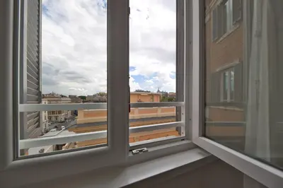 an open window with a view of a city at LH Hotel Andreotti in Rome