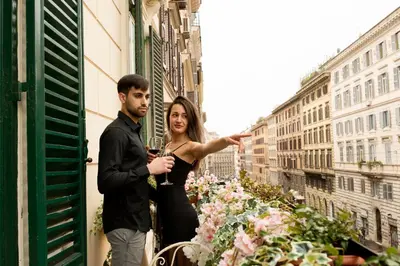 a man and a woman standing outside of a building at Nerva Accommodation Cavour in Rome