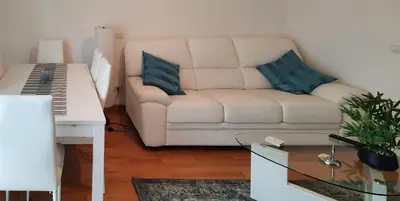 a living room with a white couch and a keyboard at Casa Maloia in Rome