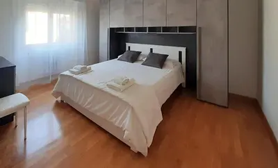 a bedroom with a large bed with two towels on it at Casa Maloia in Rome