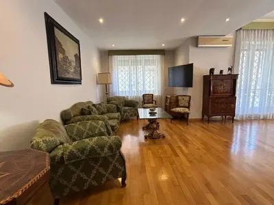 a living room with a couch and a table at Tiziano House by Ghor in Rome