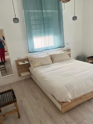 a large bed in a room with a window at CAFE Balduina in Rome