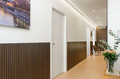 a hallway of a house with a painting on the wall at Eden Luxury Apartment in Rome