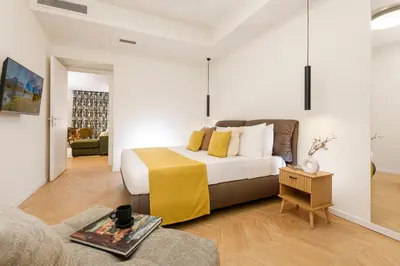 a bedroom with a king sized bed in a room at Eden Luxury Apartment in Rome