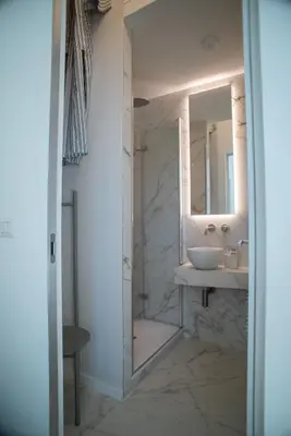 a bathroom with a sink and a mirror at Luxury Apartment - Vatican Area - Key Collection in Rome