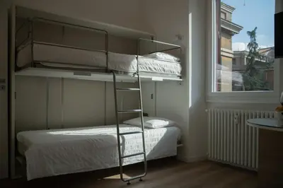 a bedroom with two bunk beds and a window at Luxury Apartment - Vatican Area - Key Collection in Rome