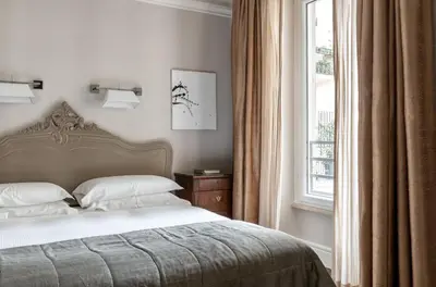 a bedroom with a bed and a window at Casa Montani in Rome