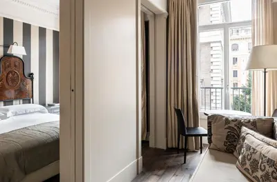 a hotel room with a bed and a window at Casa Montani in Rome
