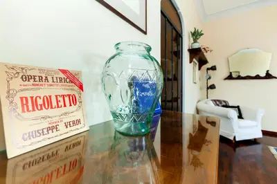 a glass vase sitting on a table next to a box at Roma Colosseo, vista da sogno in Rome