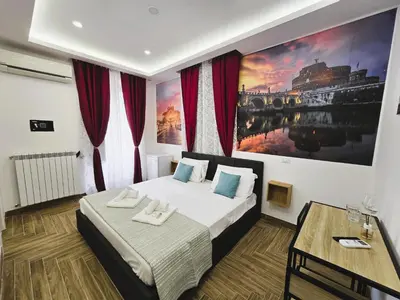 a bedroom with a bed and a painting on the wall at Susys's Guest House - Room Castel Sant'Angelo in Rome