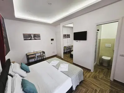 a hotel room with a bed and a television at Susys's Guest House - Room Castel Sant'Angelo in Rome
