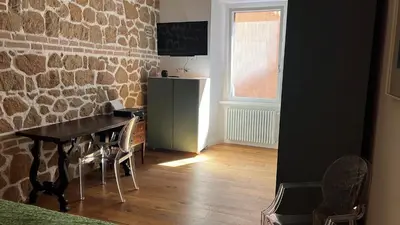 a bedroom with a bed and a flat screen tv at Luxury Loft near Via Veneto in Rome