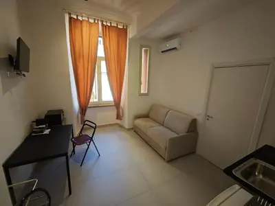 a living room with a couch and a table at Appartamento Alida in Rome
