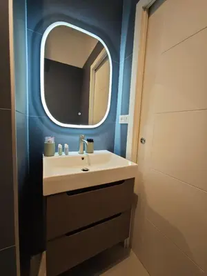 a bathroom with a sink and a mirror at Appartamento Alida in Rome