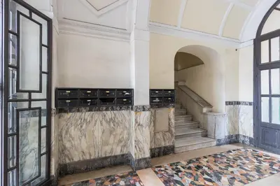 an empty room with a staircase and a window at Vista Laterana in Rome