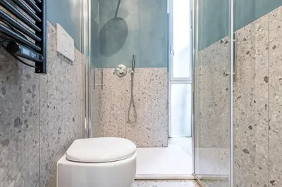 a bathroom with a toilet and a shower at Vista Laterana in Rome