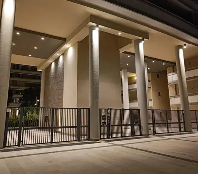 a building with columns and a gate in front at Pato's Home - Appartamento Condiviso Con Parcheggio Gratuito in Rome