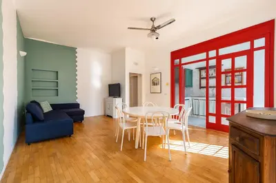 a living room with a table and chairs and a couch at Aurelio APT - Homkeey Apartments in Rome