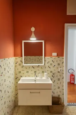 a bathroom with a sink and a mirror at Aurelio APT - Homkeey Apartments in Rome