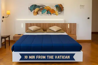 a bed in a room with a sign that says to min from the veteran at -Colosseum 15 Min -Trastevere, Free Wi-Fi and A-C in Rome