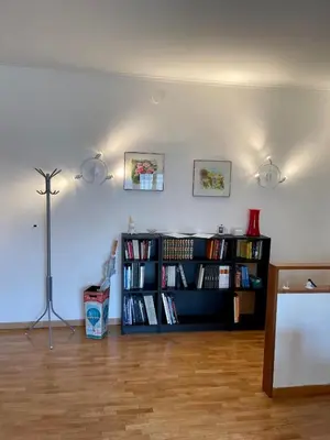 a living room with a book shelf filled with books at La Casa di Valentina in Rome