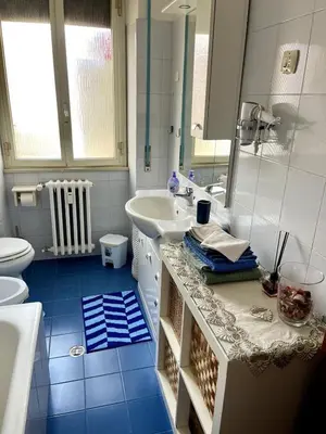 a bathroom with a sink and a toilet and a mirror at La Casa di Valentina in Rome