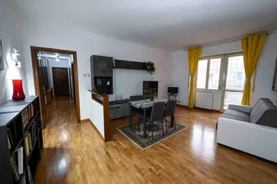 a living room with a table and a couch at La Casa di Valentina in Rome