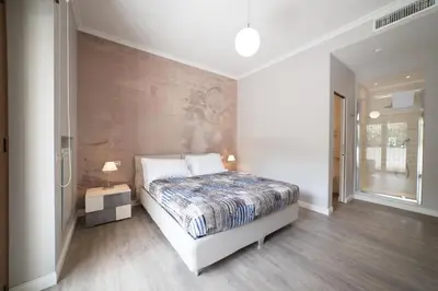 a bedroom with a bed and a wall at VaticanRhome II in Rome
