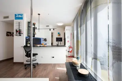 a living room with a counter and a table at Cottage with Garden and Terrace near Termini in Rome