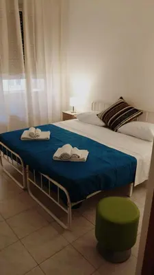 a bedroom with a large bed with towels on it at Trionfale Guest House in Rome