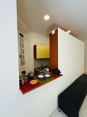 a small kitchen with a table with food on it at Trionfale Guest House in Rome
