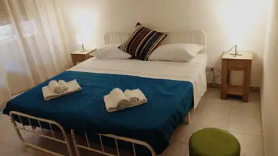 a bedroom with a bed with towels on it at Trionfale Guest House in Rome