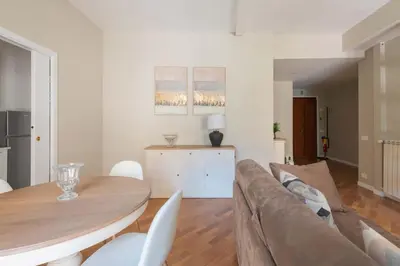 a living room with a couch and a table at SuityRHome San Giovanni 11 in Rome