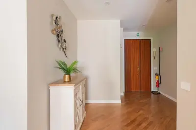 a room with a console with a plant on the wall at SuityRHome San Giovanni 11 in Rome