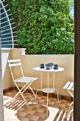 a table and a chair on a patio at Little Dome - San Pietro in Rome