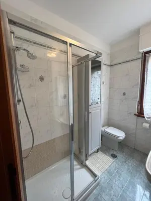 a bathroom with a shower and a toilet at Trilocale con terrazza e garage in Rome